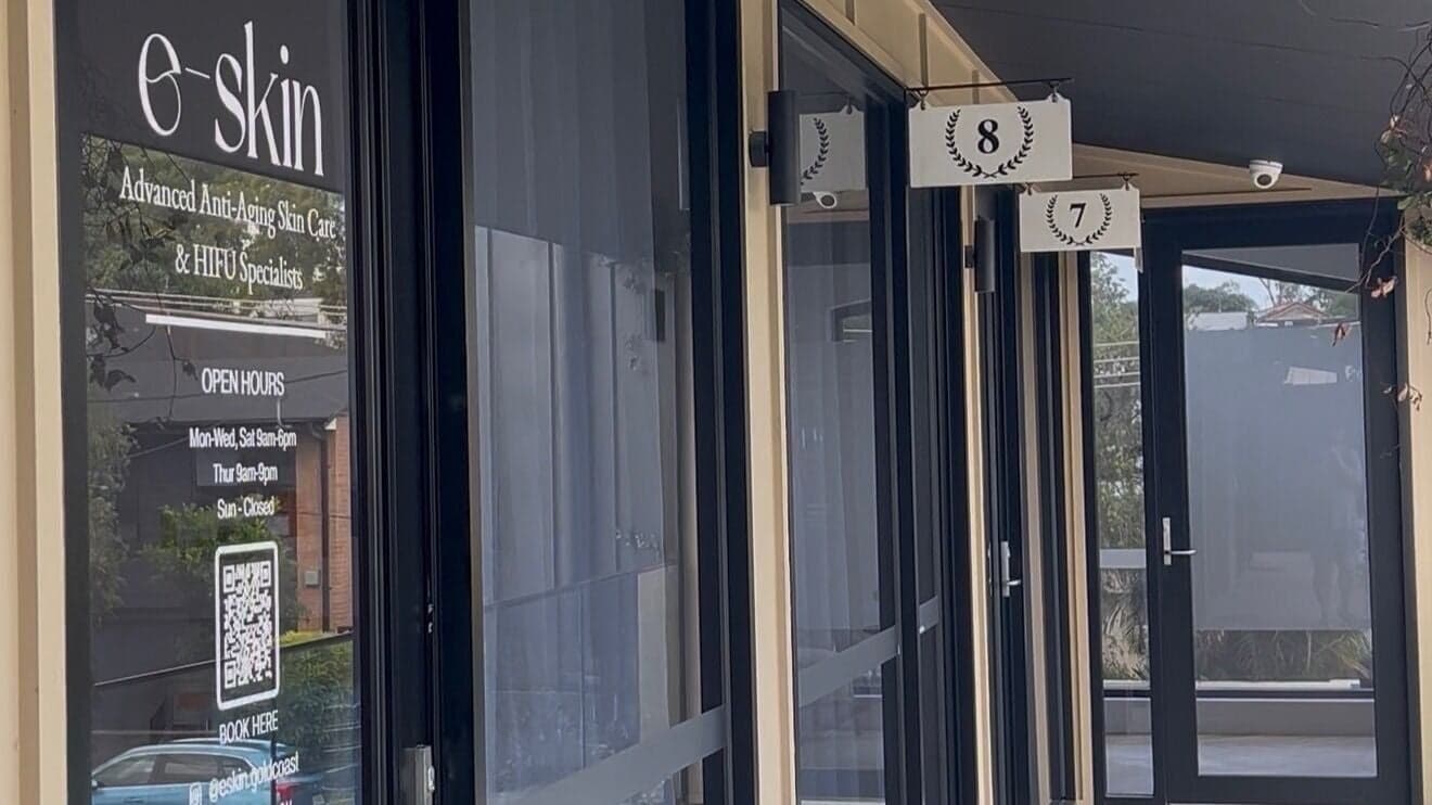 Glass entrance doors and signage at e-skin Southport